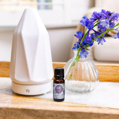 Edens Garden Lilac oil in diffuser scene promotes relaxing ambiance.