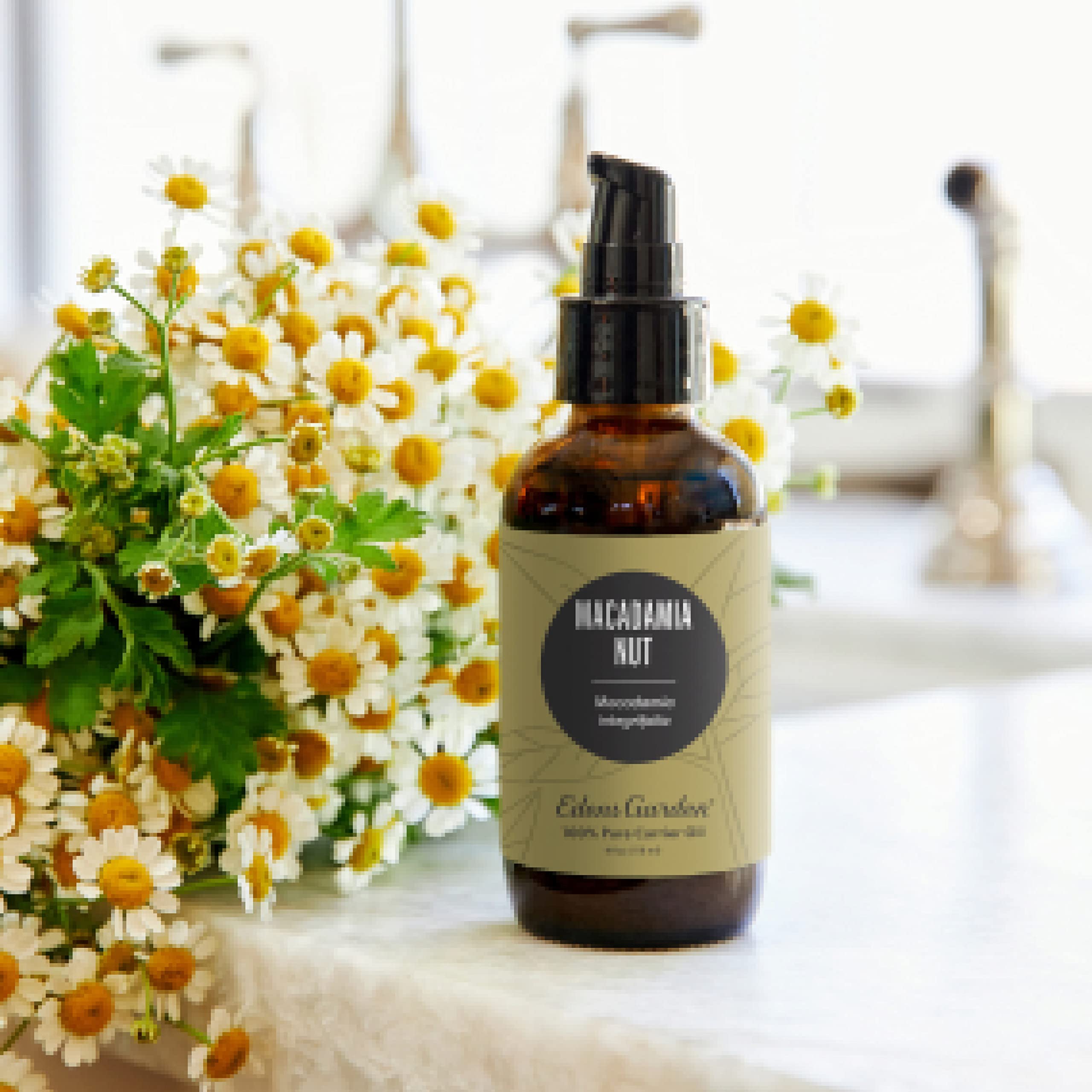 Edens Garden Macadamia Carrier Oil label shows hexane-free, pure formula.
