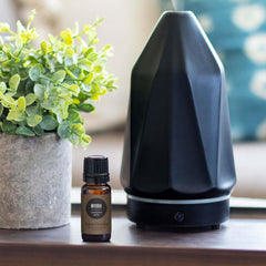 Edens Garden Myrrh oil in diffuser creating warm, earthy ambiance.