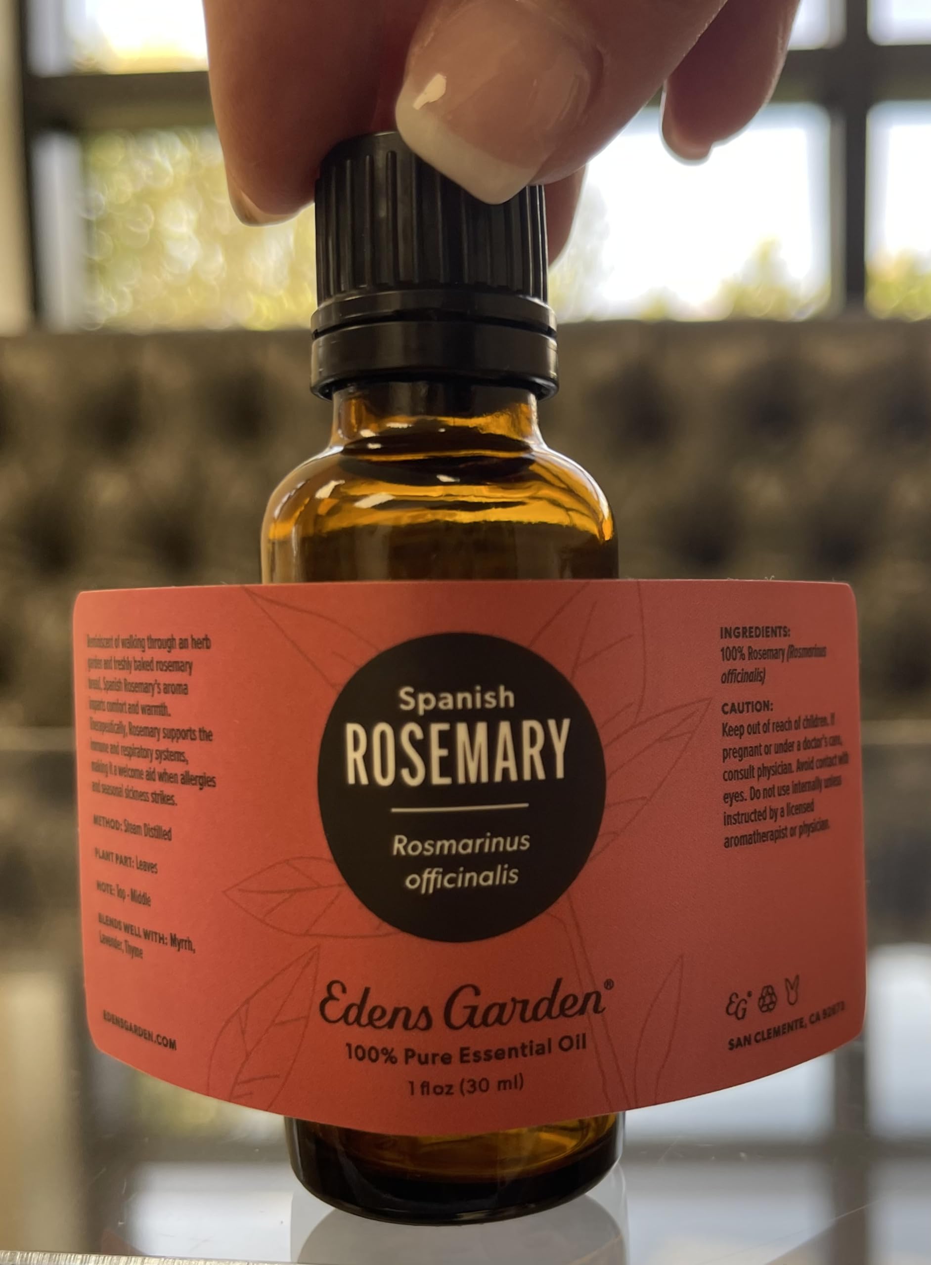 Edens Garden Rosemary Spanish essential oil label closeup showcasing purity