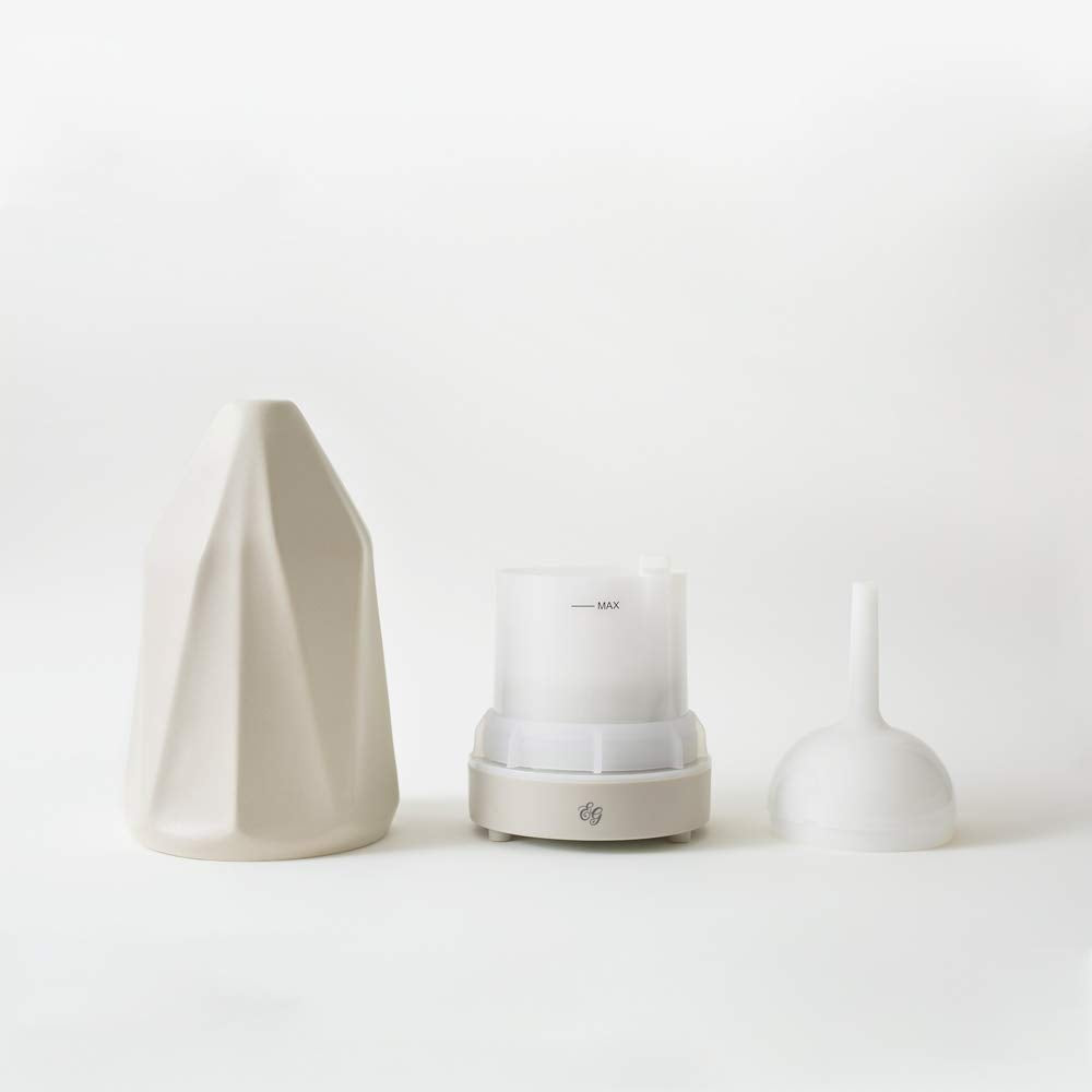 Edens Garden Tan Diamond diffuser releasing fragrant mist for calm ambiance