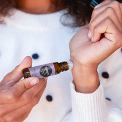 Edens Garden Tranquility roll-on on wrist offers easy, portable relaxation on the go