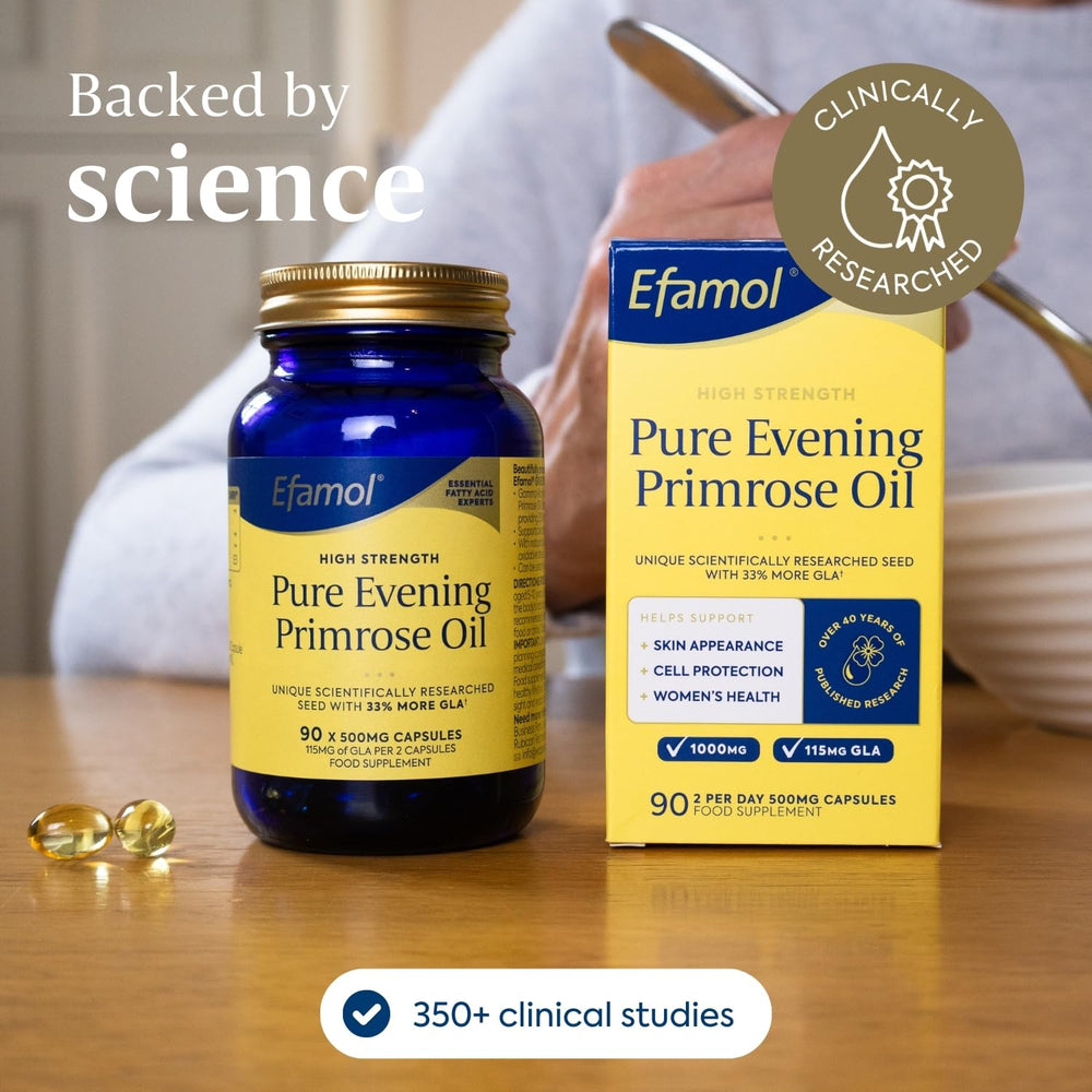 Efamol Evening Primrose Oil in-use setup beside glass.