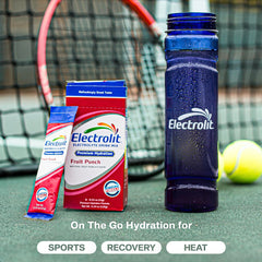 Electrolit Fruit Punch powder dissolving in water for quick refreshment.