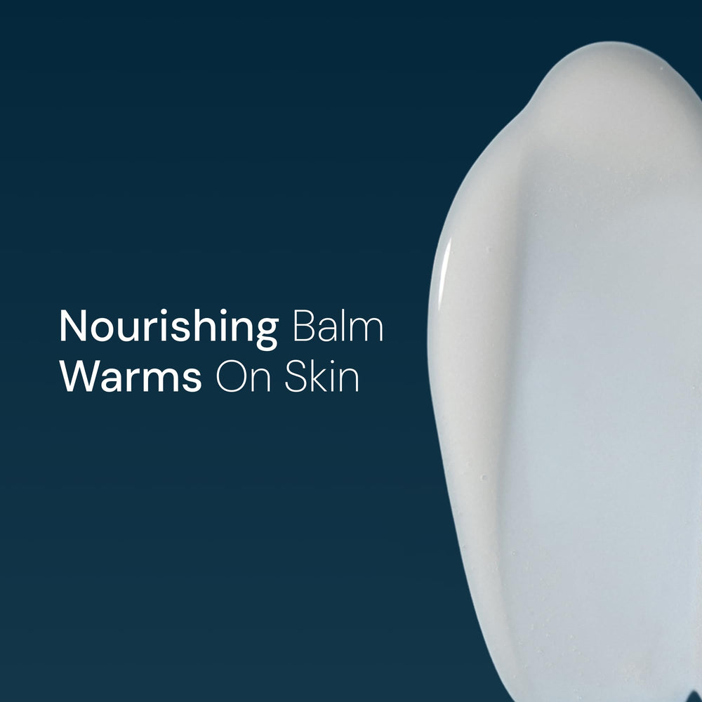 Elemis Warm-Up Massage Balm jar closeup reveals rich, nourishing formula.