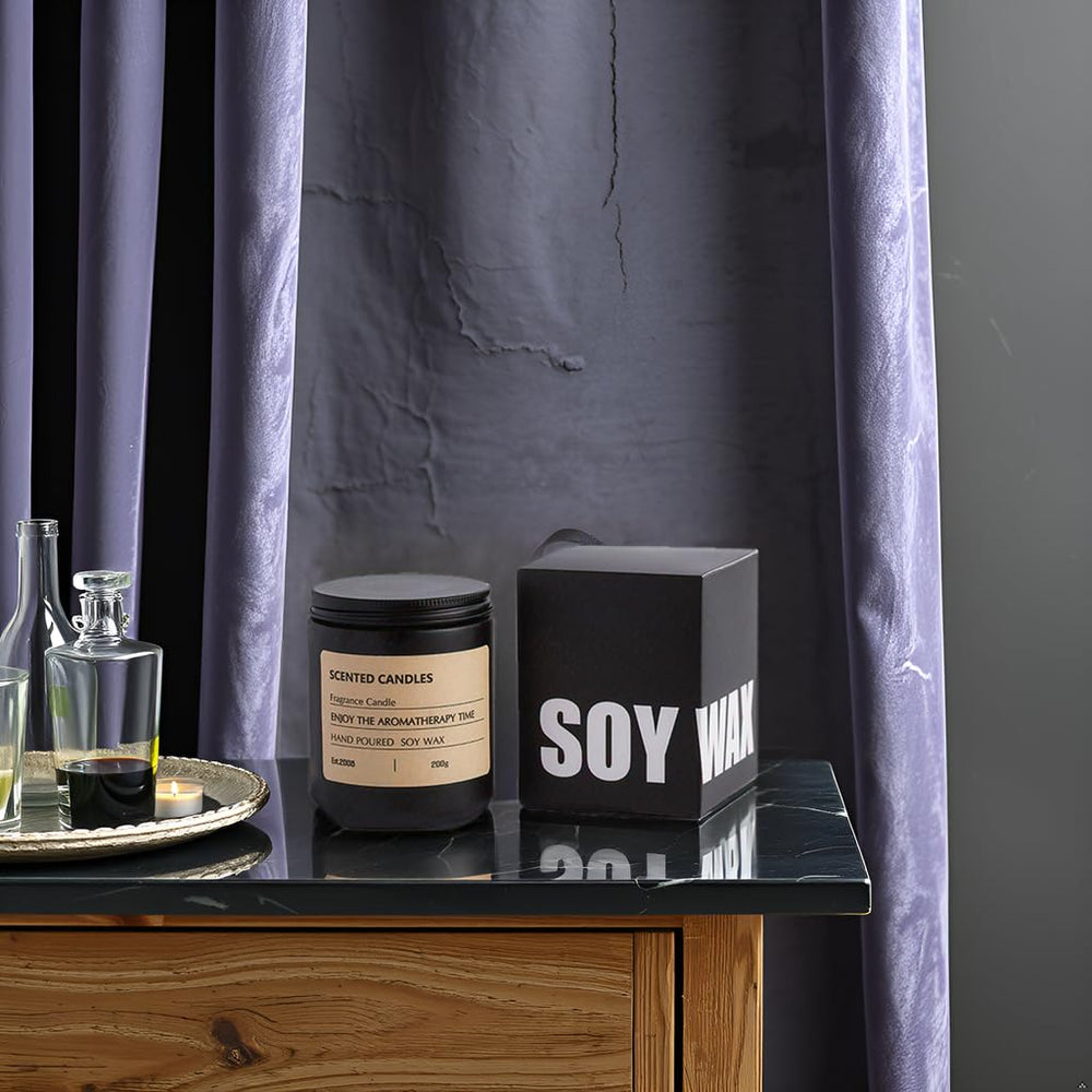 Candle in living room creates cozy, inviting atmosphere.