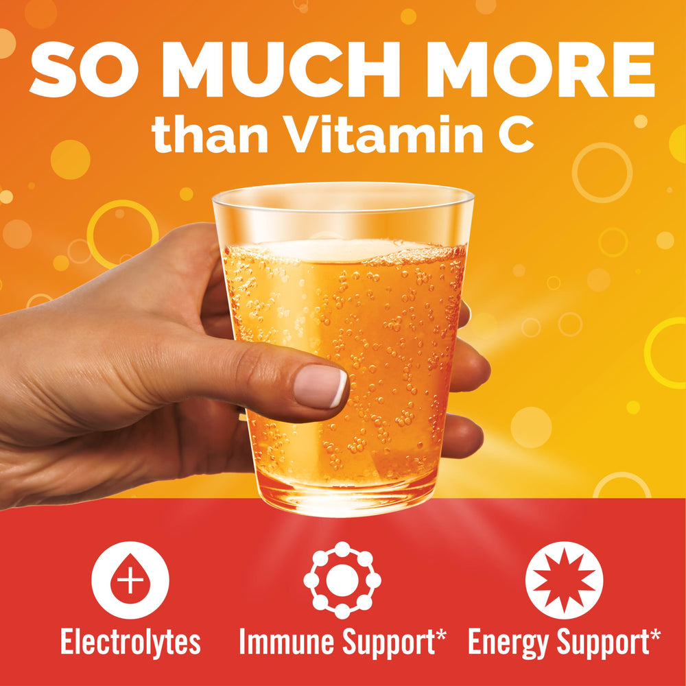 Emergen-C powder dissolving in water for a quick, refreshing orange drink