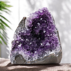 EMPORION amethyst cluster, deep purple closeup highlighting color and natural facets.