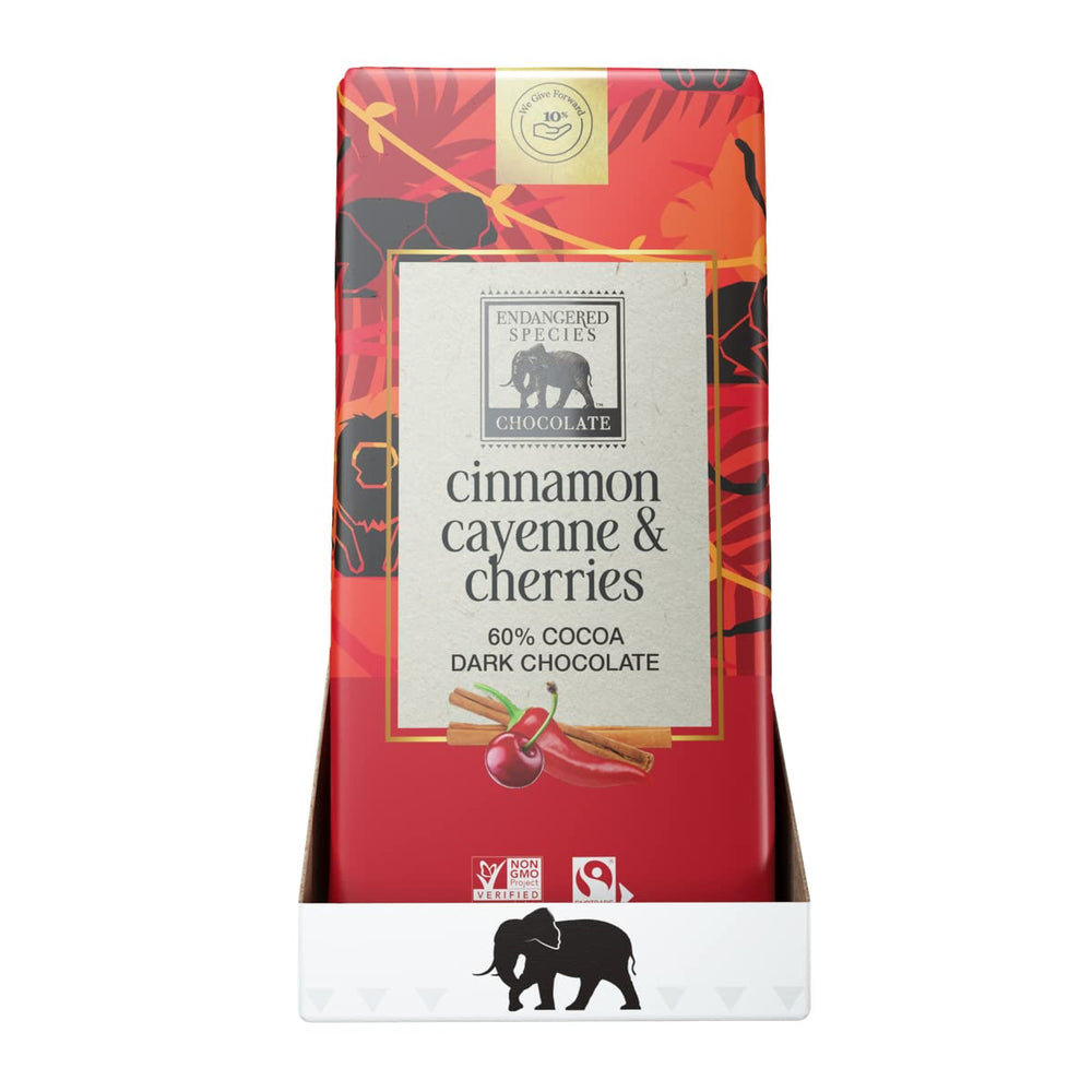 Two pieces of Endangered Species chocolate showcasing cinnamon spice and fruit center