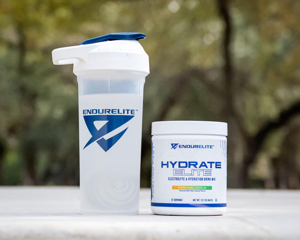 EndurElite Hydrate Elite scoop measuring electrolytes for quick rehydration.