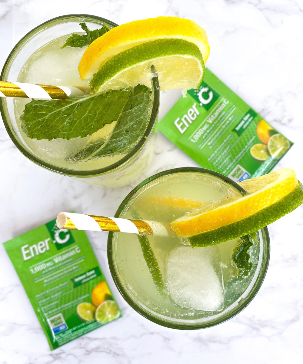Ener-C spoon mixing powder into water for quick, easy preparation.