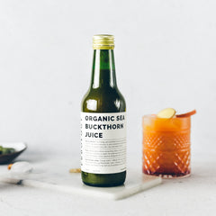 Erbology Sea Buckthorn Juice 8.5oz bottle on a kitchen shelf