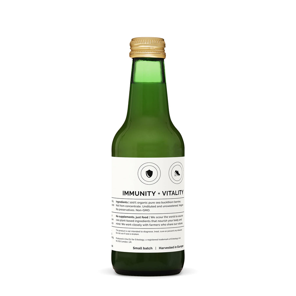 Erbology Sea Buckthorn Juice bottle in recycling bin to emphasize sustainability