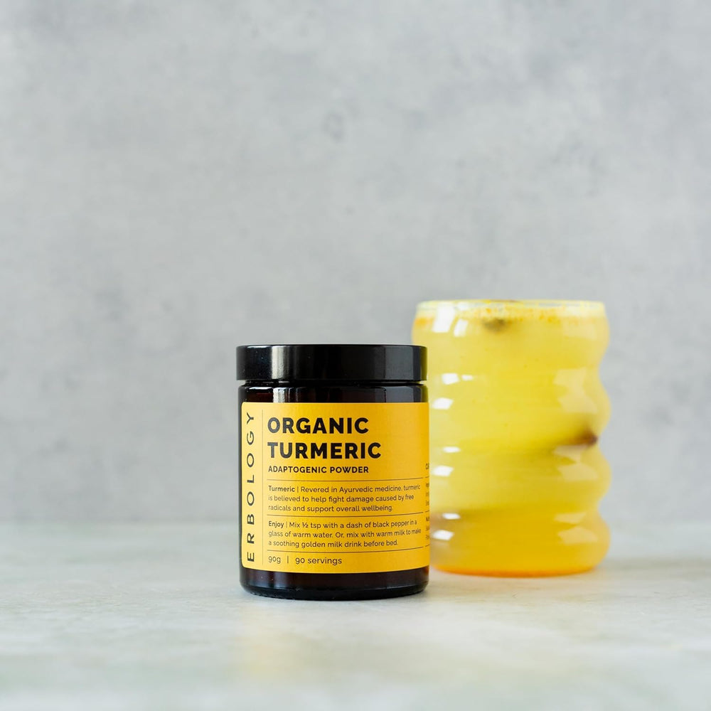Erbology turmeric powder packaging emphasizing organic, non-GMO, small-batch quality.