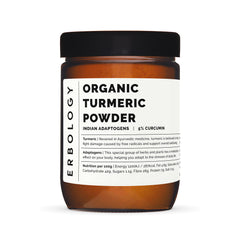 Erbology turmeric powder spoon highlighting fine texture for smoothies and spice blends.