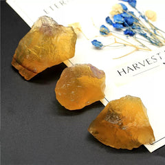 Erliway Yellow Fluorite raw crystal in velvet bag, ready as a gift.