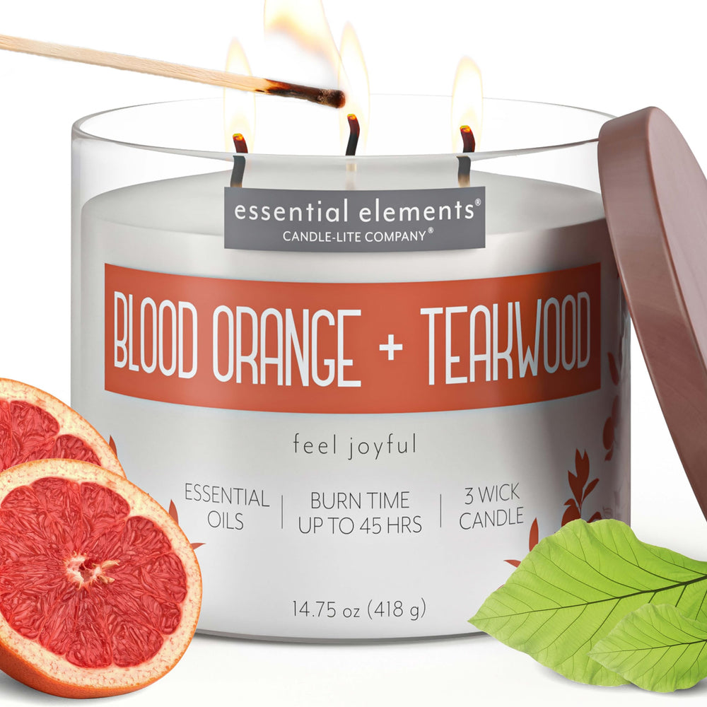 Essential Elements Blood Orange Teakwood candle label highlights premium fragrance for vibrant spaces