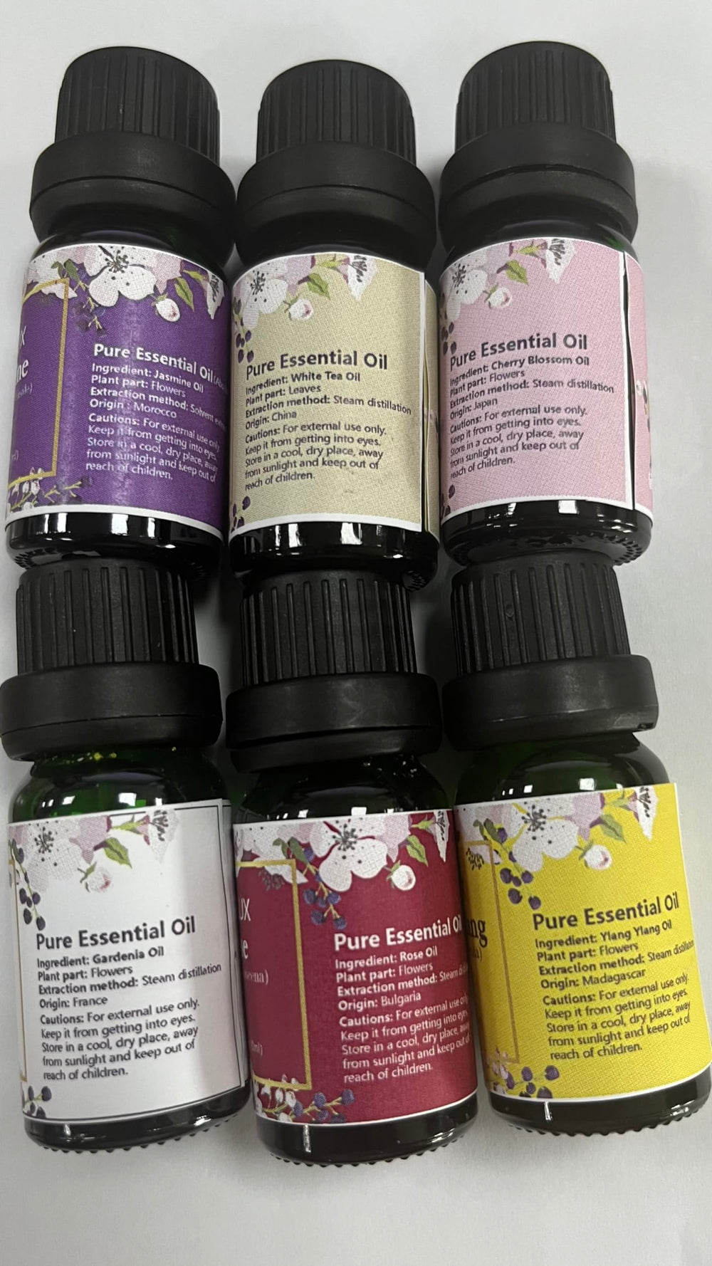 ESSLux essential oil bottle beside diffuser for a serene diffusion session.
