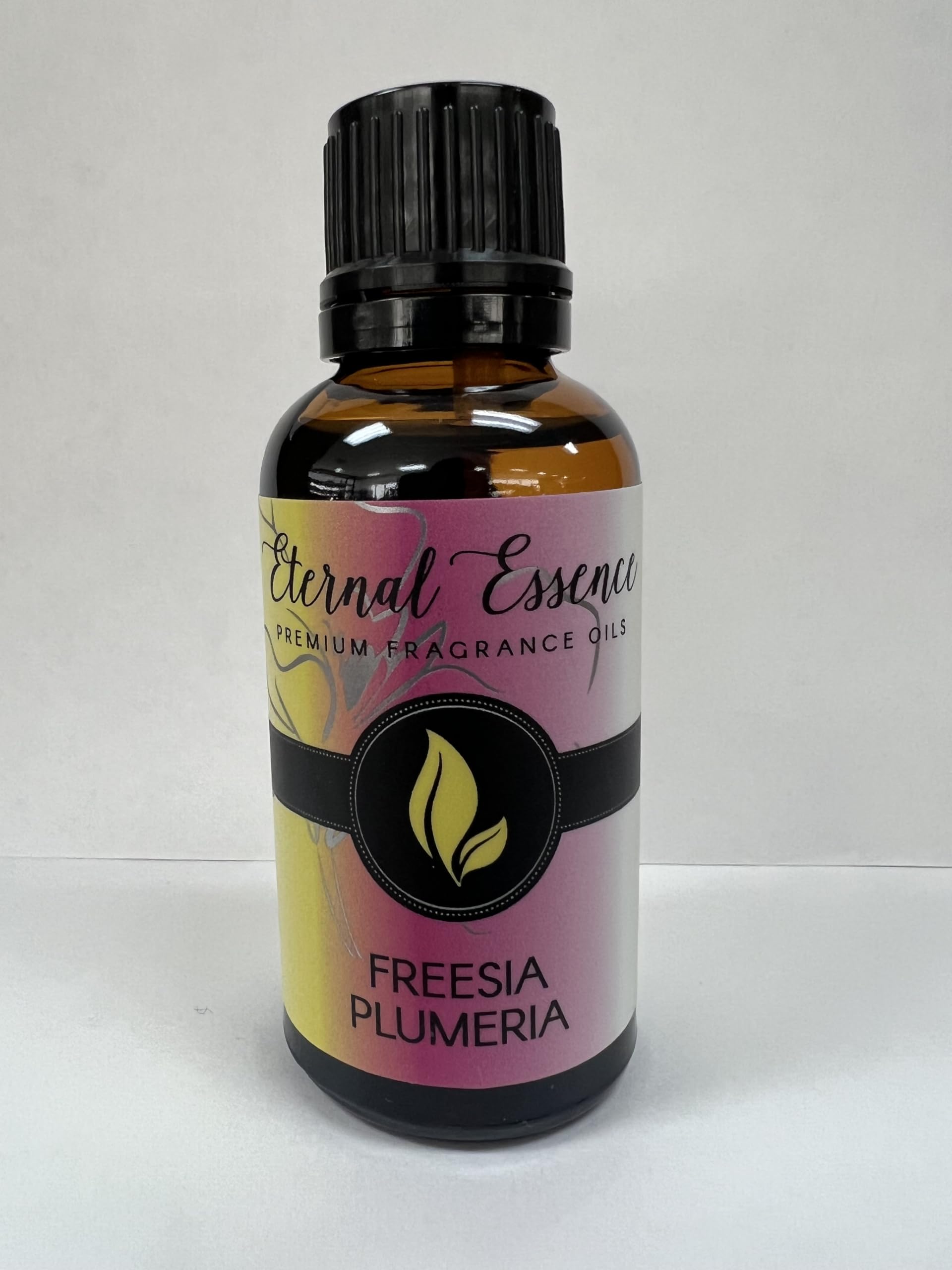 A diffuser setup using Eternal Essence Freesia Plumeria releasing bright floral aroma.