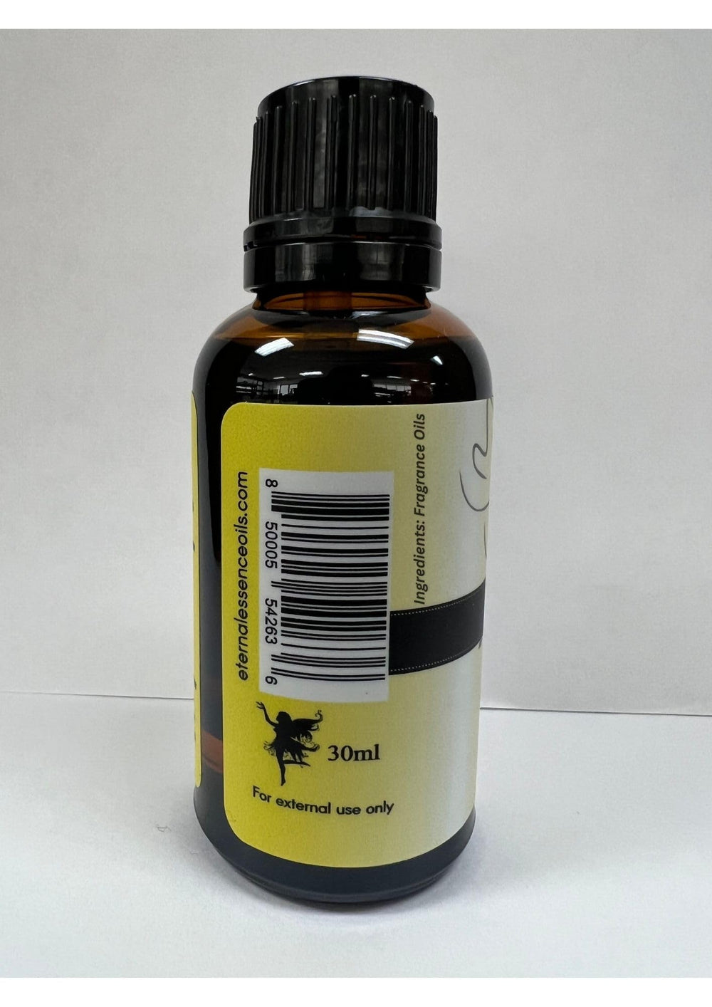 Sealed amber bottle of Eternal Essence Freesia Plumeria 30ml for storage.