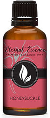 Eternal Essence Oils Honeysuckle bottle closeup, ideal for precise candle or soap scenting.