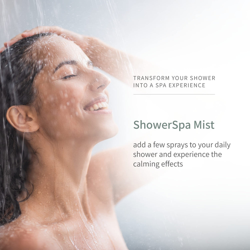 European Spa Source Eucalyptus ShowerSpa Mist in a misty bathroom with eucalyptus leaves for calming aroma.