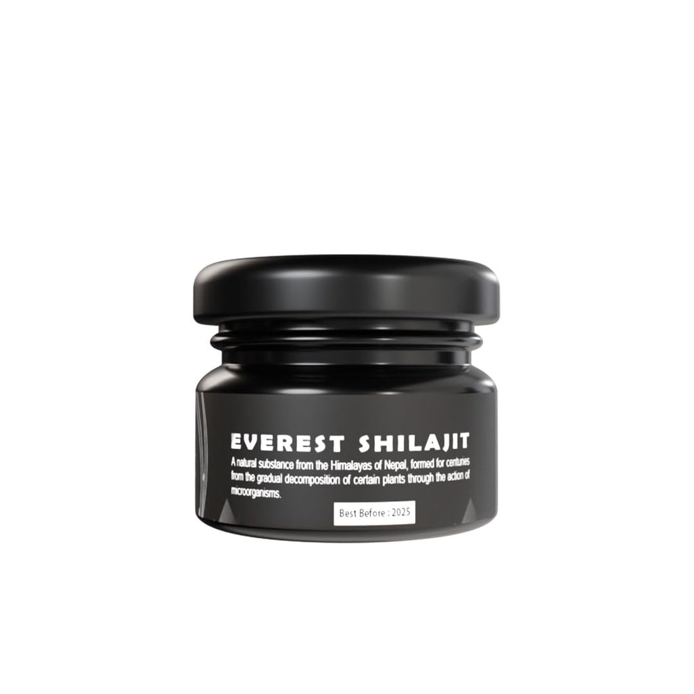 Everest Shilajit resin in a glass jar on wood, highlighting Himalayan origin.