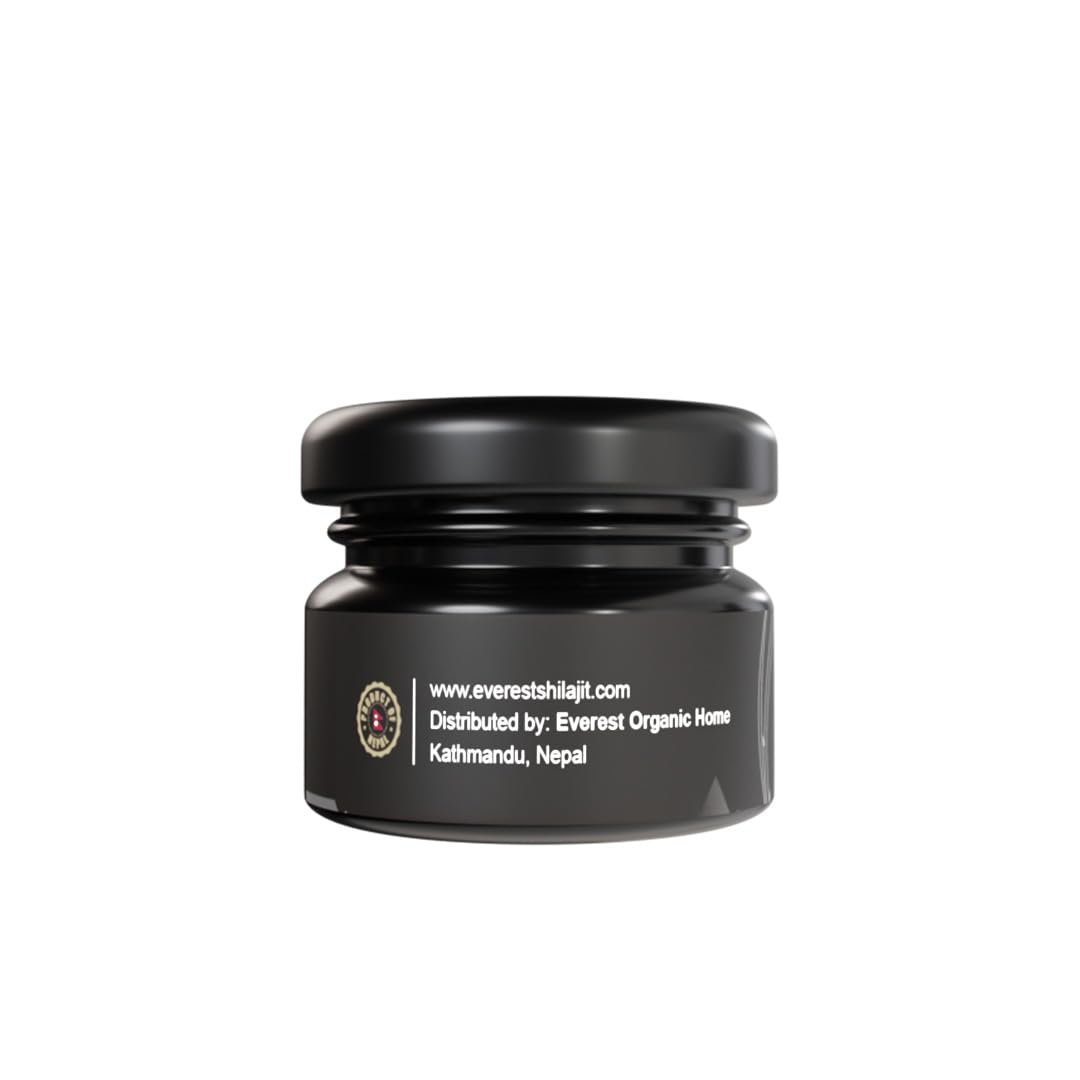 Measuring spoon beside Everest Shilajit resin for precise dosing.