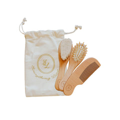 Everything Littles wooden massage brush gently detangles delicate baby hair.
