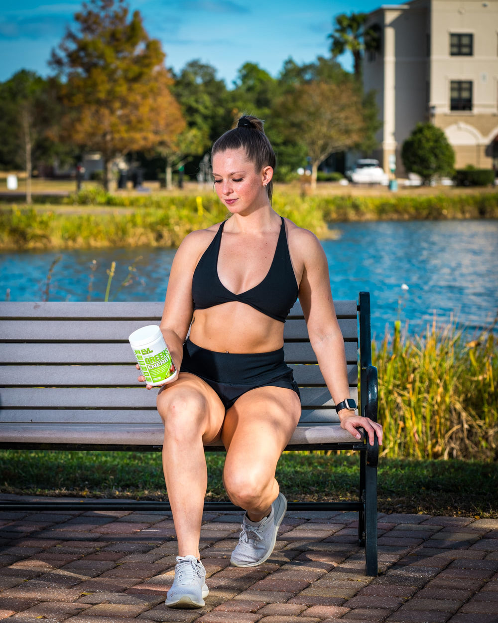 Athlete mixing EVL Super Greens after workout for a post-workout boost.