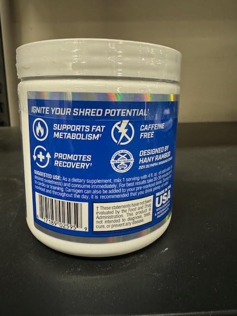 Evogen Carnigen grape flavor scoop ready for mixing in a glass.