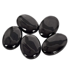 Favoramulet energy worry stone held in hand aids calm focus during routines.