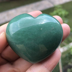 Favoramulet green aventurine heart stone in pocket for convenient stress relief on the go.