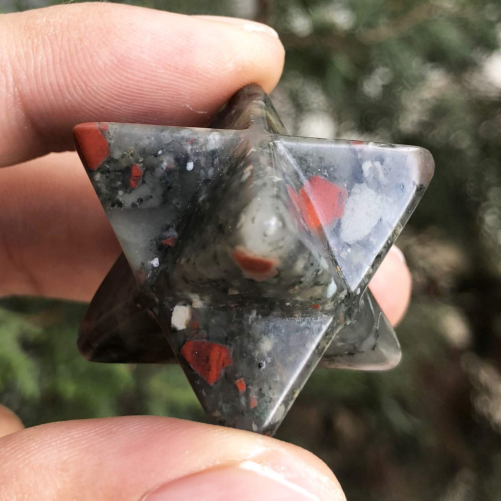 Favoramulet hand-carved Merkaba star close-up highlighting focus and spiritual awareness.