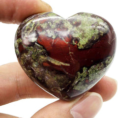 Favoramulet polished palm worry stone in hand for stress relief and focus