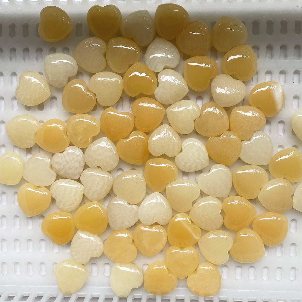 Fekuar polished yellow heart worry stone for relaxation during meditation.