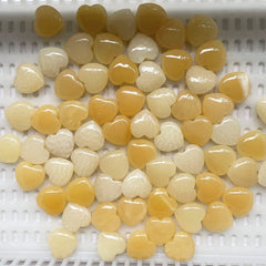 Fekuar polished yellow heart worry stone for relaxation during meditation.