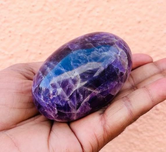 Feng shui decor amethyst lingam promotes harmonious home energy.