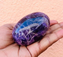Feng shui decor amethyst lingam promotes harmonious home energy.