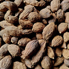 FHDYURE Amomum Tsaoko Cao Guo powder in spoon for easy measuring and even flavor.