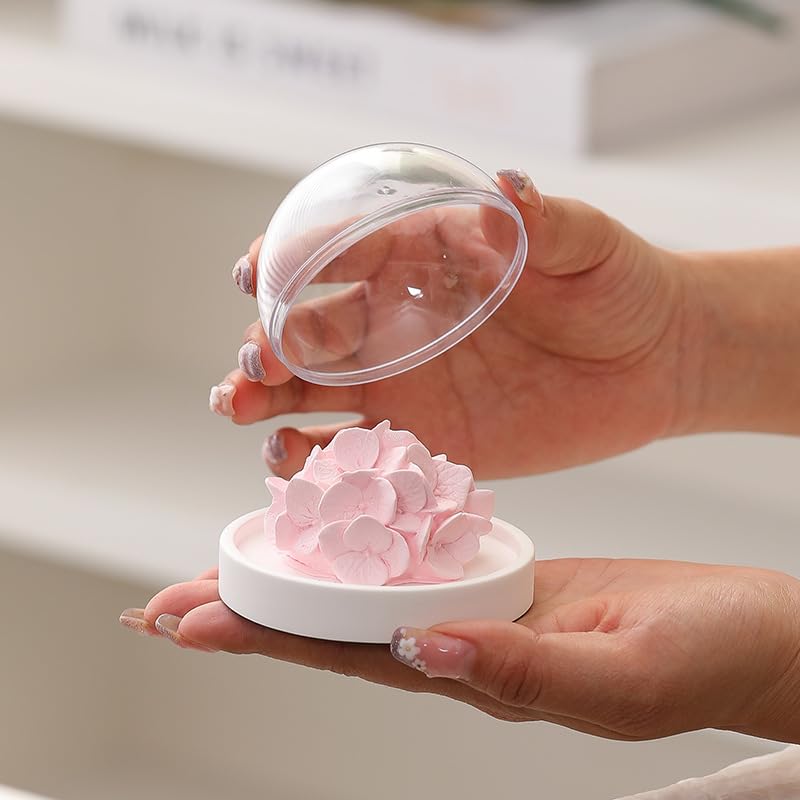 FLCSIed porcelain diffuser base with pink hydrangea bloom on a wood stand.