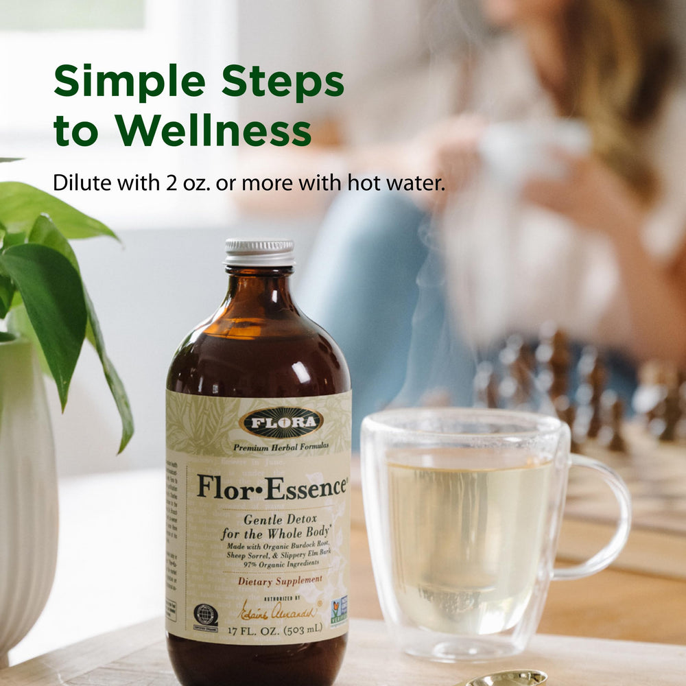 Thistle component visible beside the Flora Flor Essence bottle for premium herbal blend.