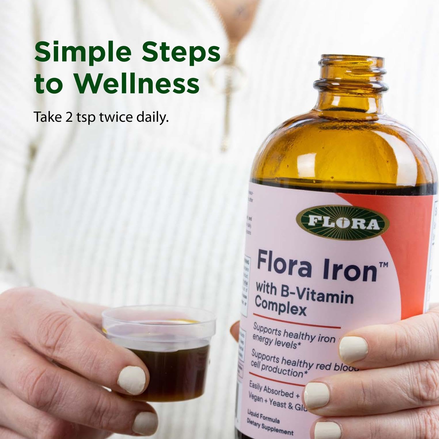 Flora Iron glass bottle signals premium packaging and gentle formula.