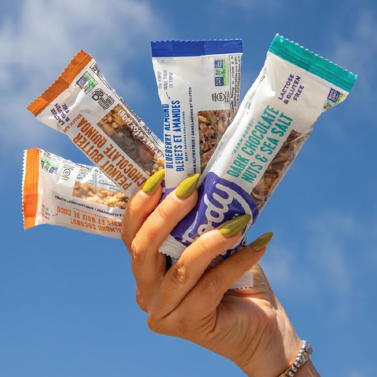 Fody Blueberry Almond snack bar in hand for portability.