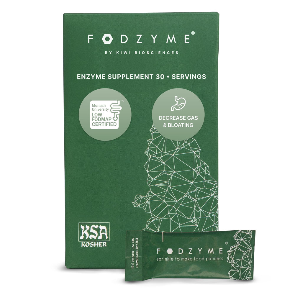 FODZYME on-the-go bottle pour demonstrates portable gut support while dining.