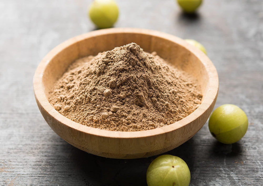 Food to Live Amla Powder tea infusion fills the cup with a warm aroma.