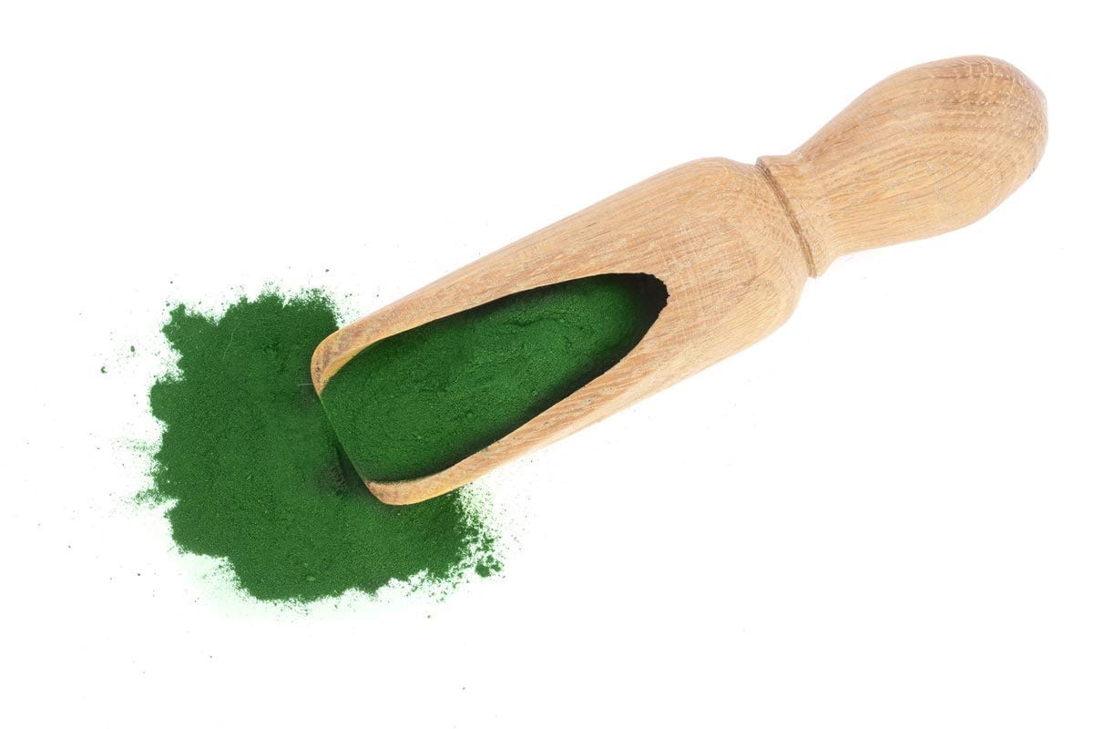 Food to Live spirulina powder shown with iron-rich nutrient info on label.