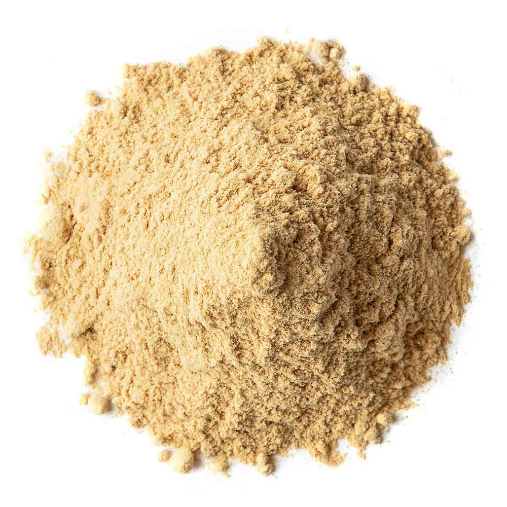 Food to Live Triphala Powder spoon ready for measuring into recipes.
