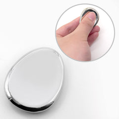 ForFine thumb stone in hand showing compact size for pocket carry