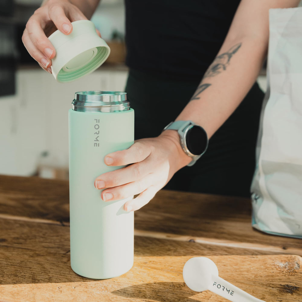 FORME Blender Shaker Sea Mist bottle inside gym bag ready for workouts